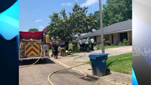 Lafayette Firefighters outside residential home