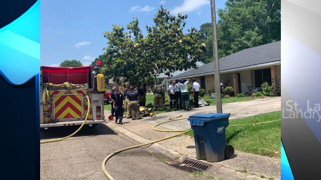 Lafayette Firefighters outside residential home